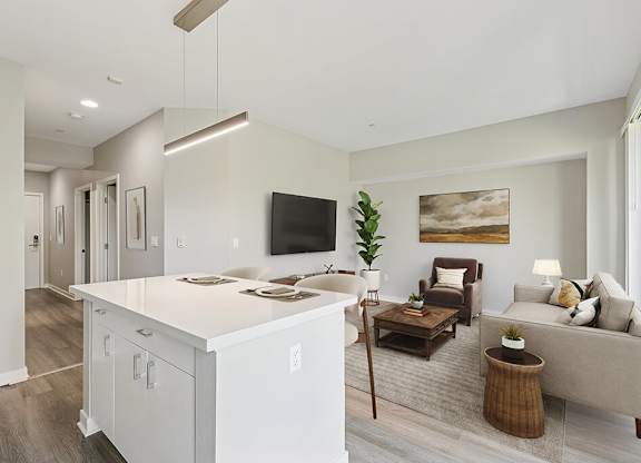 Renovated kitchen and living room at Riverpark Apartments in Redmond WA