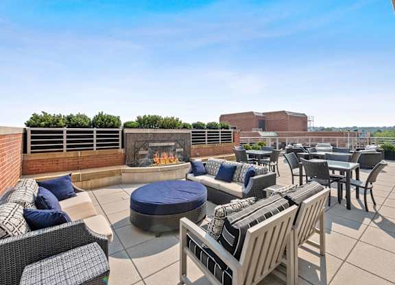 Rooftop terrace fireplace and chairs at Bradley Braddock Road Station Apartments in Alexandria VA