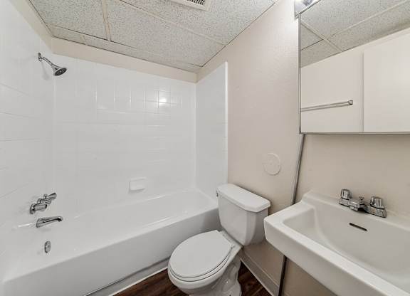Bathroom with sink and tub at Ridgemoor Apartment Homes in Lakewood CO