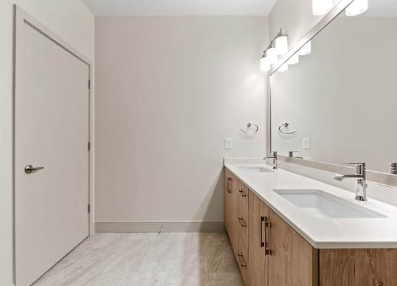 Vacant bathroom double sink at VERO Apartments in Chelsea MA