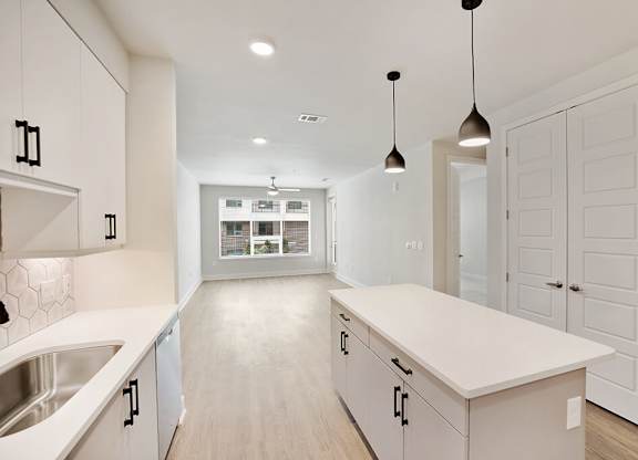 Chrome Design Package Kitchen and Living Room at 1810 Main Apartments in Houston TX