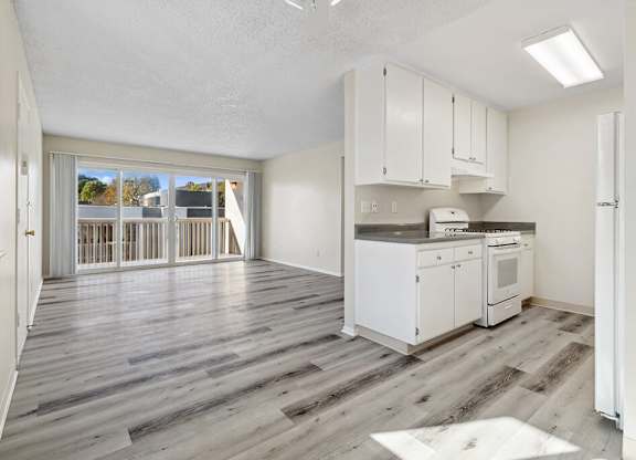 Dining Area and Living Room at Canyon Rim Apartments in San Diego CA