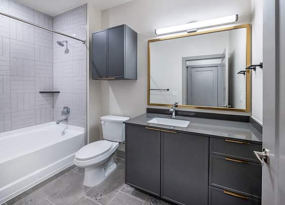 Bathroom with toilet and shower at Heights at 1520 Apartments in Houston TX