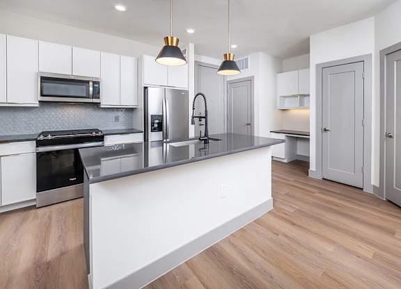 Modern vacant kitchen at Heights at 1520 Apartments in Houston TX