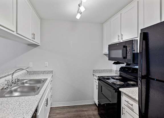 Black kitchen appliances at Hilltop Commons Apartments in San Pablo CA