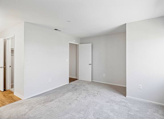 Carpeted bedroom at Hilltop Commons Apartments in San Pablo CA