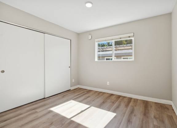 Main bedroom with closet at Park Crest Apartments in San Diego CA