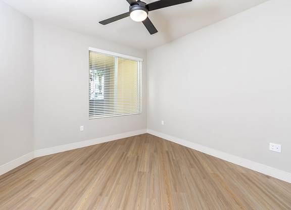 Vacant Metallic Rose Design Package Bedroom at Bowen Apartments in San Diego CA