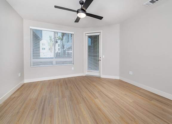 Vacant Metallic Rose Design Package Living Room at Bowen Apartments in San Diego CA
