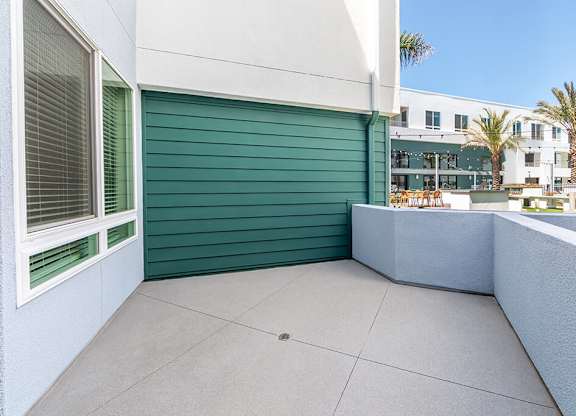 Vacant Metallic Rose Design Package Patio at Bowen Apartments in San Diego CA