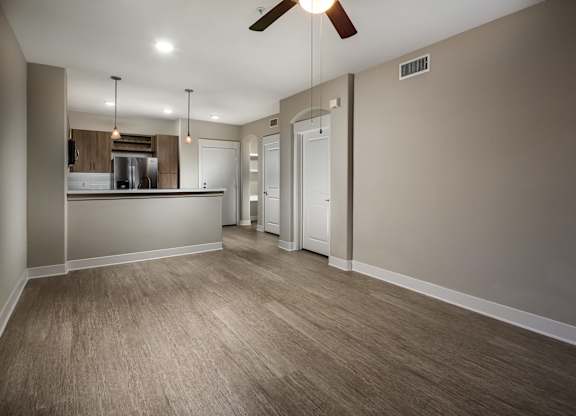 Living room and kitchen at Madison at Town Center Apartments in Santa Clarita CA