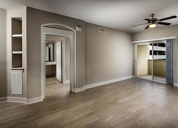 Living room with ceiling fan at Madison at Town Center Apartments in Santa Clarita CA