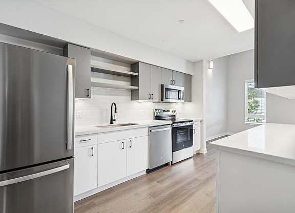 Renovated kitchen galley kitchen at Riverpark Apartments in Redmond WA