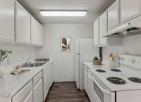 Kitchen with appliances at Ridgemoor Apartment Homes in Lakewood CO