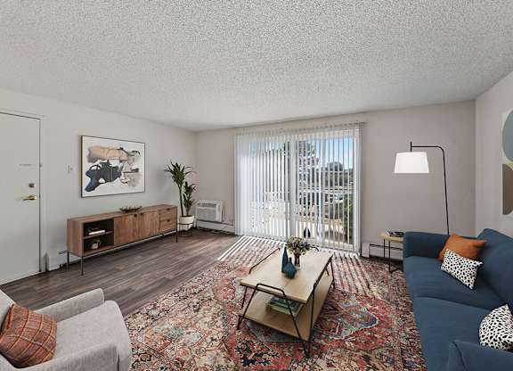 Living room with hardwood flooring at Ridgemoor Apartment Homes in Lakewood CO
