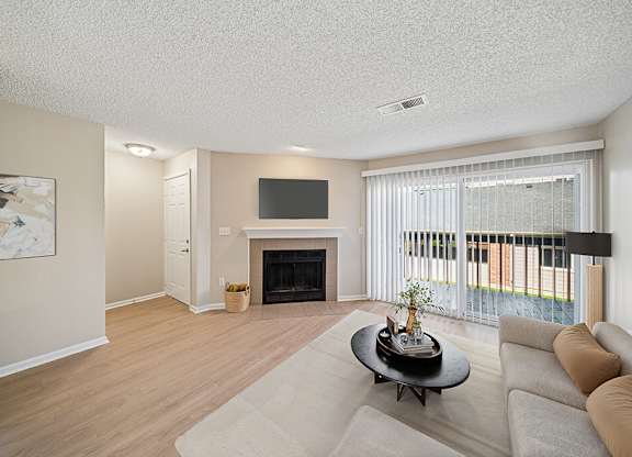 Living room with fireplace at Rock Peak on Sunset Apartments in Longmont CO