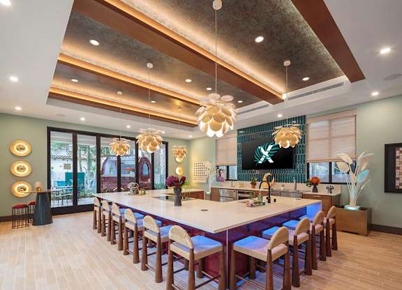 Poolside dining lounge at CALIXA Apartment Homes in Camarillo CA