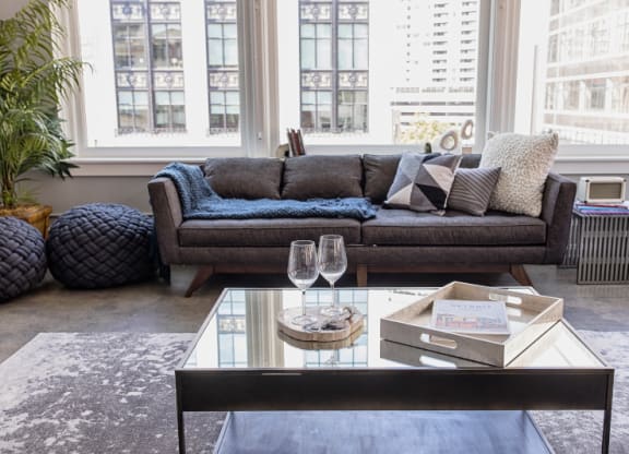 Living Room Filled with Furniture and a Large Table  at Fourteen56, Detroit, MI