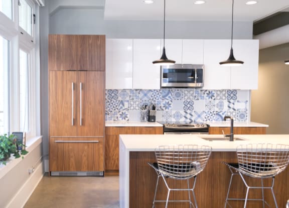 Kitchen with Wooden Cabinets and Island at Fourteen56, Detroit, MI