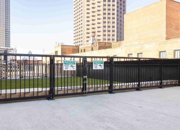 Outdoor pet relief dog park area. at The May, Cleveland, OH, 44114