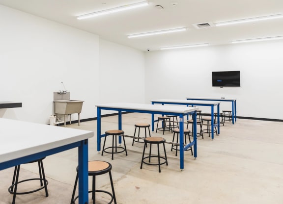 Community art and maker space with wash sink and working tables at The May.