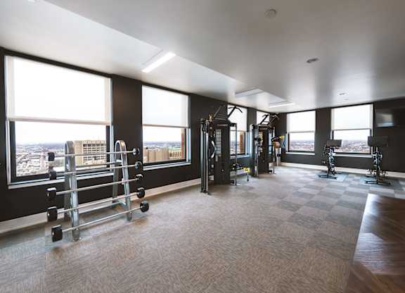 The gym at The Stott with a view of the city.