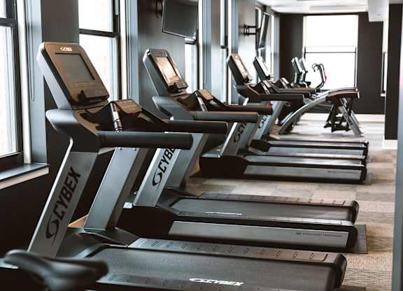 A row of treadmills in The Stott fitness center.