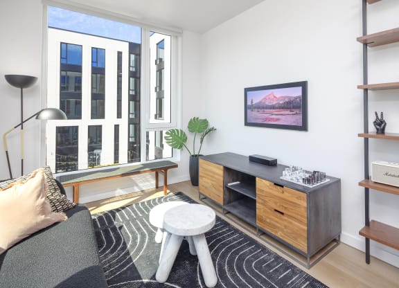 a living room with a couch and a coffee table at The Weidler in Portland, OR 97209