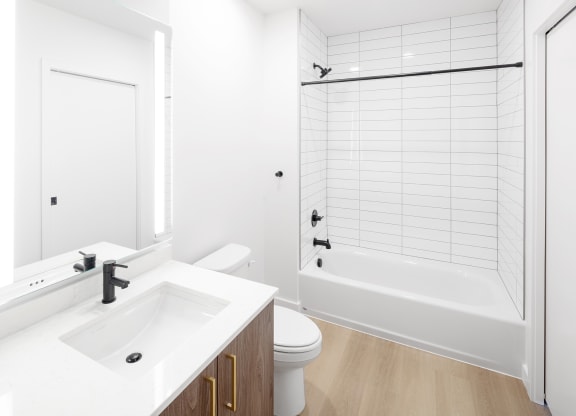 a bathroom with a sink toilet and a shower at The Weidler in Portland, OR 97209