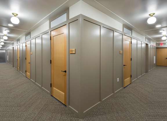 A long hallway with doors on both sides.