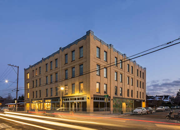 A long exposure shot of a building with a street in front of it.