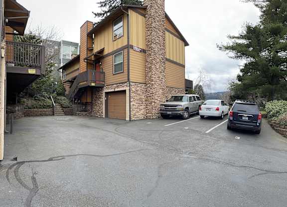 a parking lot in front of a house