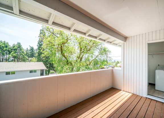 A balcony with a washing machine on it.