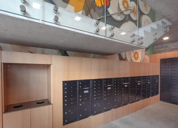 a view of the lockers in a room with a painting on the wall at The Weidler in Portland, OR 97209