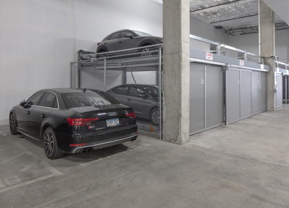 a car parked in a parking garage with a car on top of a rack at The Weidler in Portland, OR 97209