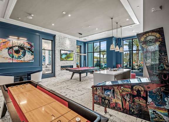 a game room with a pool table and a painting on the wall at Altis Twin Lakes Apartments, Florida
