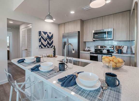 a kitchen with a counter top and a sink at Altis Santa Barbara, Florida