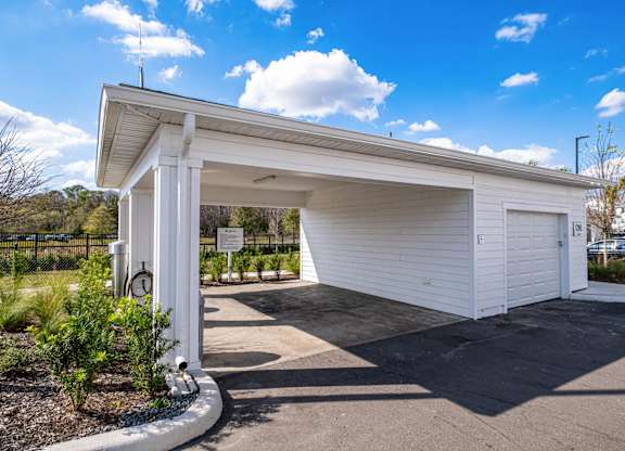A white garage door is open.