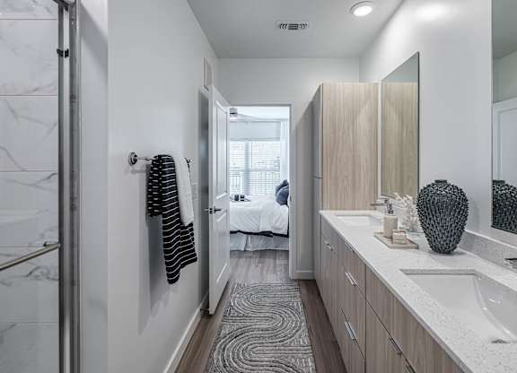 a bathroom with a sink and a mirror at Altis Grand Suncoast, Florida