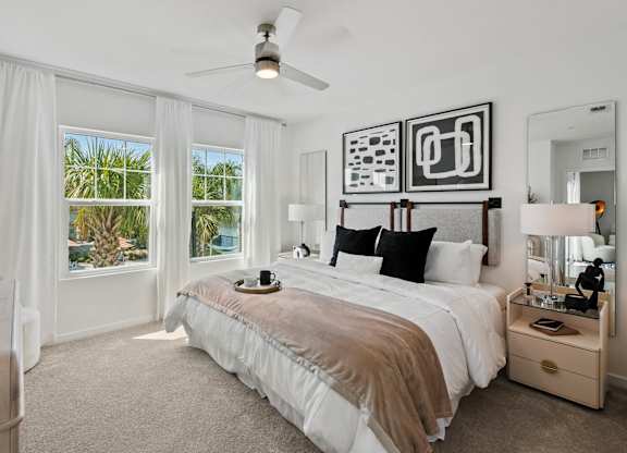 a bedroom with a bed and a ceiling fan at Altis Grand Suncoast, Land O' Lakes, 34638