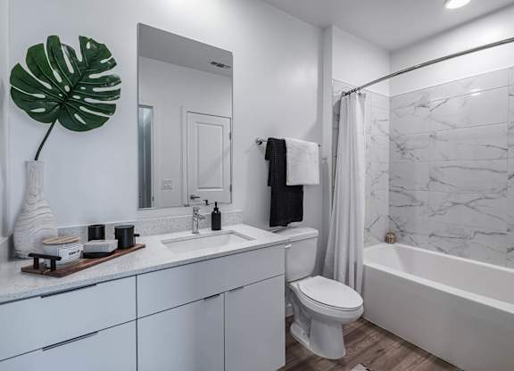 a bathroom with a sink toilet and a shower at Altis Grand Suncoast, Florida