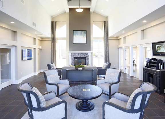 A living room with a fireplace and a television.