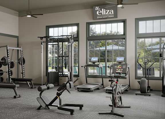 A gym with a variety of equipment including weights, treadmills, and exercise bikes.