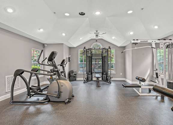 A spacious home gym with a variety of exercise equipment.