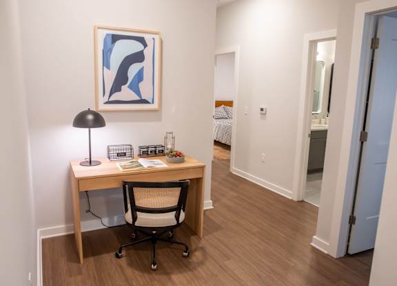 A room with a desk and a chair.