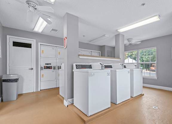 A laundry room with a washer and dryer in it.