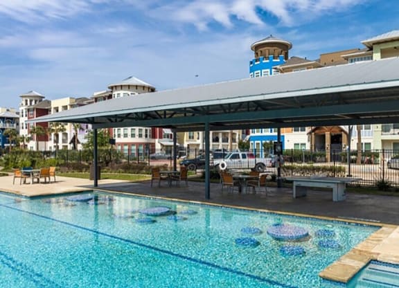 a swimming pool with a canopy over it