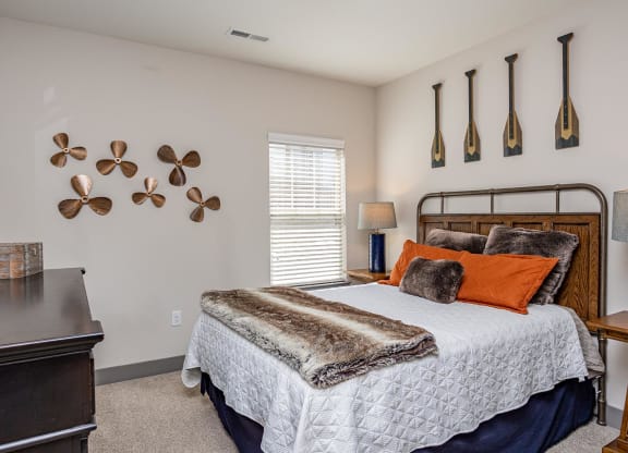 a bedroom with a bed and a desk