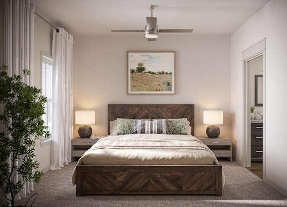 a bedroom with a bed and a ceiling fan