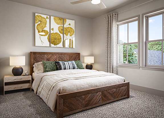 a bedroom with a bed and a ceiling fan at Allier Port Wentworth Apartments, Port Wentworth, GA